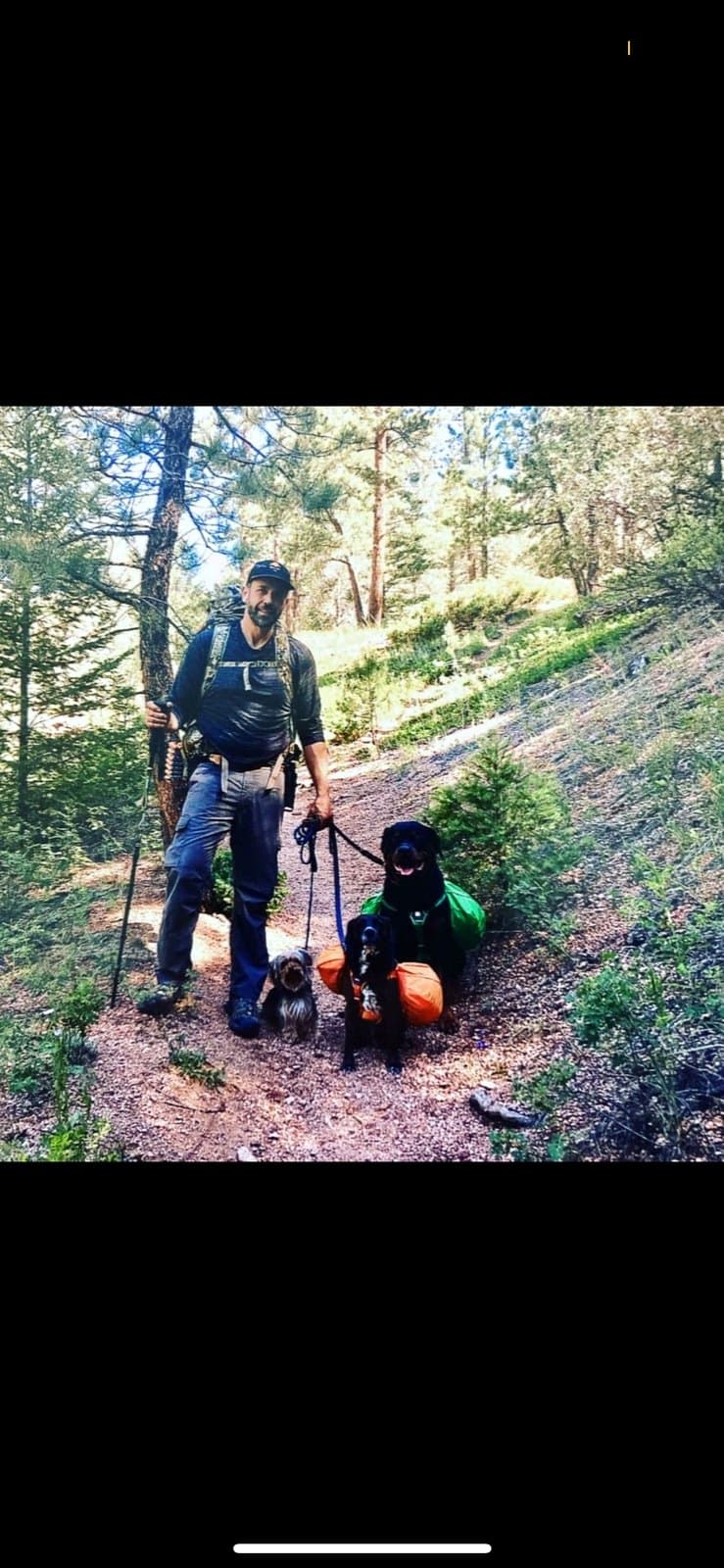 Brett Endes hiking and training a dog on the trail